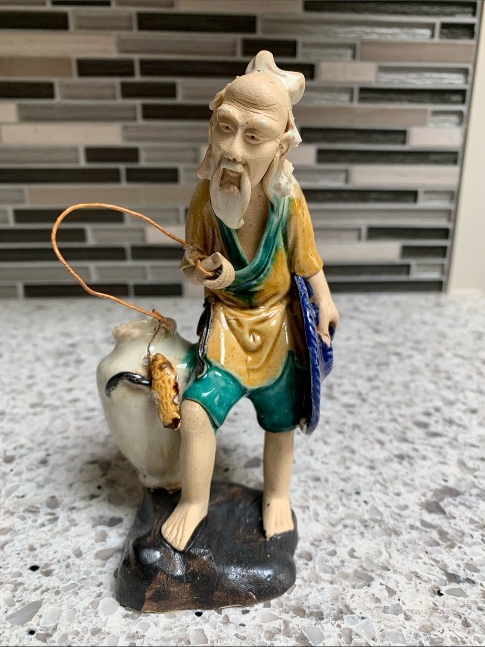 Hand-Made & Painted Collectable Ceramic Fisherman Figurine. Pre-Owned. Size:3x6.
